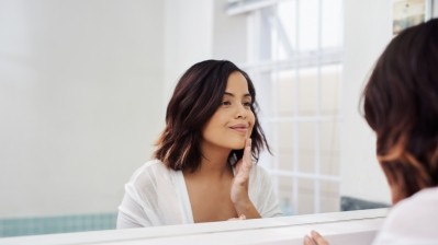 GettyImages - Latino woman with healthy skin / mapodile